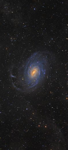 an image of a spiral galaxy in the sky