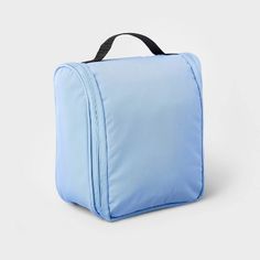 a blue lunch bag with black handles on the front and side, sitting against a white background