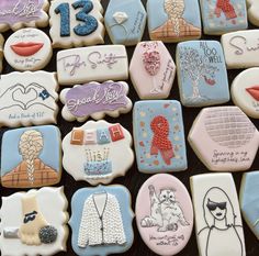 decorated cookies are arranged in the shape of women's clothing and letters on them