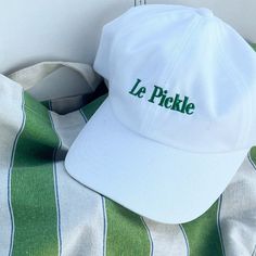 The perfect hat for Pickle Lovers and Pickle Ball champs. * 100% chino cotton twill * Green Camo color is 35% chino cotton twill, 65% polyester * Unstructured, 6-panel, low-profile * 6 embroidered eyelets * 3 ⅛" (7.6 cm) crown * Adjustable strap with antique buckle * Blank product sourced from Vietnam or Bangladesh This product is made especially for you as soon as you place an order, which is why it takes us a bit longer to deliver it to you. Making products on demand instead of in bulk helps reduce overproduction, so thank you for making thoughtful purchasing decisions! Pickle Lover, Pickle Ball, Camo Colors, Green Camo, Trucker Cap, Pickles, Low Profile, Cotton Twill, Camouflage