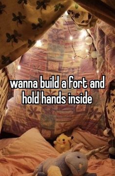 a stuffed animal sitting on top of a bed under a canopy with the words wanna build a fort and hold hands inside