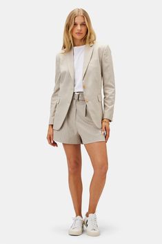 Inspired by classic suiting, these tailored linen blend shorts are effortlessly chic with a paper bag waist, distinctive front pleat, and handy side pockets. Pleated front shorts with fitted waist, fabric belt with urea buckle, and zip flyAngles front pockets and back welt pockets 67% Recycled Polyester, 26% (FSC) Viscose 6% Linen, 1% Spandex 14" Rise 2 3/4" Inseam Ethically Made in India Part of a matching set Suit Shorts Outfit, Hoi An Tailor, Tailored Shorts, Linen Short, Belted Shorts, Pleated Shorts, Fabric Belt, Tailored Suits, Striped Linen