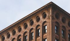 a tall building with many windows on top