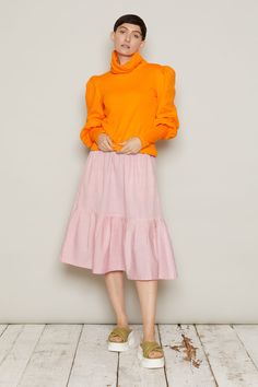 A floaty midi skirt with a deep, softly gathered hem, the Finndis skirt is easy to wear, with a pretty edgeTwo designs are available, in soft tones, evocative of Iceland’s flora: Rhubarb Pink or Dandelion Orange. Note the beautiful attention to detail in the design, thanks to the colour contrast pocketsThe elasticated waistband at the back gives a perfect fit. Ethically made in vegan, 100% cotton. Inclusive sizing, available in XS to 6XLEach skirt is numbered and production is limited to 100 pie Feminine Maxi Skirt With Ruffle Hem, Flowy Midi Skirt With Ruffle Hem, Chic Pink Voluminous Maxi Skirt, Chic Voluminous Pink Maxi Skirt, Spring Maxi Skirt With Ruffle Hem And Voluminous Fit, Flowy Ruffled Midi Maxi Skirt, Spring Layered Hem Midi Skirt, Feminine Fall Ruffled Skirt, Feminine Ruffled Skirt For Fall