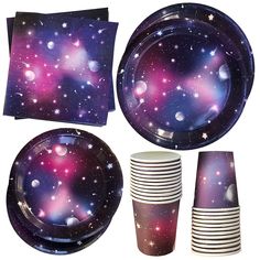 a purple and blue space themed party set with plates, napkins, cups and napkins