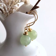 "6662 Green Jade Earrings natural stone dangle drops simple modern everyday casual boho chic gold plate birthday anniversary Valentine's day Mother's day Christmas stuffing stockings holiday gift for her women mom sister wife girlfriend daughter niece aunt grandma cousin colleague best friend. Enjoy the beauty & power of natural gemstones. MATERIALS & DIMENSIONS ✦ Natural JADE, light green, smooth round beads 10mm; ✦ GOLD Plated pins, spacers and handmade fish hook ear wires; ✦ The total length Trendy Gold Jewelry With Natural Stones, Elegant Green Earrings For Mother's Day, Chic Green Jewelry For Gifts, Gold Earrings With Natural Stones For Everyday, Minimalist Gemstone Earrings For May Birthstone, Everyday Gold Earrings With Natural Stones, Minimalist Gold Earrings For Mother's Day, Gold Minimalist Earrings For Mother's Day, Minimalist May Birthstone Earrings