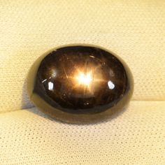 13.55ct BEST GRADE - NATURAL BLACK STAR SAPPHIRE - Cabochon !! Item Specifies  Gem Type : -  Natural Black Star Sapphire  Weight :-  13.55 Carat.  Gem Size :-   15.02 x 11.34 Depth 7.00 MM  Color :-  Black 6 Ray Star As Video  Shape :-  Star Oval Cabochon  Clarity :-   SI  Opaque   Origin :-  Thailand  Hardness:-  9.00  Quantity :-  1 Pieces   Treatment : - Treated   Items Code : -        B.ST-2057  7/7/18 Your browser does not support the video tag. Star Sapphire Gemstone, Black Star Sapphire, Sapphire Gem, Sapphire Cabochon, Star Sapphire, Black Star, Sapphire Gemstone, Oval Cabochon, Diamond Gemstone