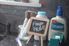 a chalkboard with writing on it next to toothbrushes