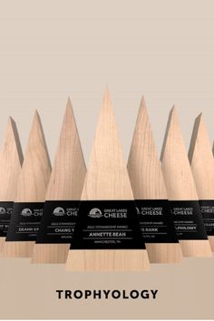 a row of wooden fence posts with the words trophy in front of them and an image of