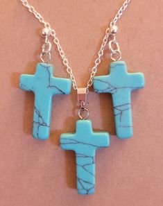 Matching cross earrings and pendant set. Earrings are Sterling silver posts with either turquoise or golden cat eye stone cross. Necklace is also Sterling silver 20inch chain with matching pendant. Turquoise Cross Pendant Necklace As Gift, Golden Cat, Cat Eye Stone, Stone Cross, Cats Eye Stone, Necklace And Earrings Set, Earring Display, Cross Earrings, Large Earrings