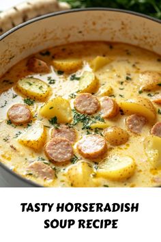 a close up of a bowl of soup with potatoes and sausage