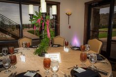 a table set with silverware and place settings