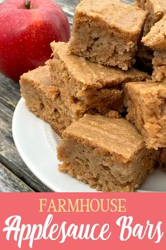 some brownies on a plate with an apple in the background