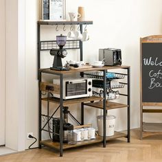 a coffee bar is set up in front of a chalkboard