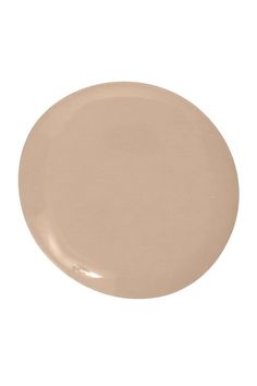 a beige plate on a white background