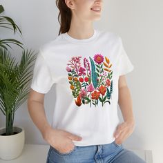 🌸 Dive into nature's elegance with our Floral Pattern Shirt. A cascade of boho wildflowers, this tee blends cottagecore charm with vintage botanical vibes. Ideal for flower enthusiasts, it's a pastel haven for anyone adoring nature's artistry. A thoughtful gift for wives or that special woman in your life. Celebrate the garden's beauty, one petal at a time. 🌼🍃 #NatureNest #BotanicalBliss #WifeWonderGift Floral Flower Embroidery Pattern Plant Print Graphic Shirt Gift for Her Gift for Wife Wife Flower Embroidery Pattern, Floral Pattern Shirt, Garden Lover Gifts, Wife Gifts, Women Flower, Pattern Shirt, Plant Print, Pastel Floral, Flower Shirt