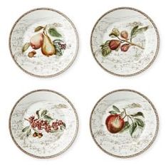 four plates with fruit painted on them