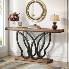 a console table with a mirror on the wall