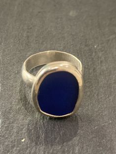 A hand made sterling silver ring set with a piece of cobalt blue coloured sea glass.  The sea glass is set into a fine silver bezel mounted on a sterling silver Band . The band is a 5mm half circle profile band..The ring is size a smaller size, O or US size 7.25 Circle Profile, Sea Glass Rings, Sea Glass Ring, Sterling Silver Rings Set, Silver Ring Set, Glass Ring, Half Circle, Glass Rings, Sterling Silver Bands