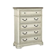 a white dresser with four drawers and two doors on the bottom drawer, in front of a