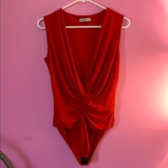 Red Bodysuit, Soft And Comfortable Material, Never Worn - Size L .. I Think This Is From Fashionnova But I Cannot Be Sure! 1 Red Fitted V-neck Bodysuit, Fitted Red V-neck Bodysuit, Red V-neck Bodysuit For Spring, Spring Red V-neck Bodysuit, Red Sleeveless Bodysuit For Spring, Chic Red Bodysuit For Spring, Spring Red Bodysuit For Night Out, Red Bodysuit For Spring Night Out, Red Bodysuit For Night Out In Spring