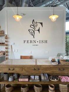 the interior of fern - fish home with baskets on the table and hanging lights above it