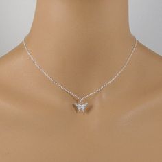 This beautiful crystal butterfly necklace is made with a dainty silver-plated crystal encrusted butterfly pendant and is suspended on a sterling silver chain with a sterling silver clasp. The necklace is available in five necklace lengths, please choose the necklace length you need from the drop-down menu. The necklace will arrive in an attractive gift box. Dainty Silver Butterfly Necklace For Wedding, Sterling Silver Butterfly Necklace For Wedding, Delicate Silver Butterfly Necklace With Clavicle Chain, Silver Sterling Butterfly Necklace, Silver Sterling Butterfly Necklace With Butterfly Clasp, Delicate Silver Sterling Silver Butterfly Necklace, Dainty Sterling Silver Butterfly Charm Necklace, Dainty Sterling Silver Charm Necklaces With Butterfly Charm, Delicate Sterling Silver Butterfly Necklace