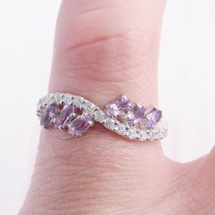 Amethyst ring, Wedding band silver, Wedding ring for her, Women wedding ring, Marquise ring, February birthstone, Unique wedding band WE OFFER UNLIMITED PERIOD INSTALLMENTS PLAN This is a beautiful, stunning, feminine ring that works well for all occasions, styles, and ages. You will love it! Ring information: Main stones: Amethyst Approximate size: 4*2mm (6 stones) Accents stones: White cubic zirconia Approximate size: 1.5mm (21 stones) Metal type: Silver Metal stamp: 925 Sterling Silver Instal Sterling Silver Amethyst Wedding Ring, Wedding Sterling Silver Amethyst Ring, Amethyst Promise Ring With Stone Setting, Elegant Stackable Wedding Rings With Stone Setting, Elegant Wedding Stackable Rings With Stone Setting, Silver Amethyst Ring With Accent Stones For Wedding, Silver Amethyst Wedding Ring Fine Jewelry, White Gold Hallmarked Amethyst Wedding Ring, Silver Amethyst Ring For Wedding