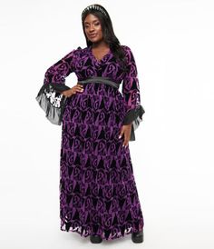 A charming maxi silhouette crafted in a smooth and lightweight purple woven fabric that dances with a black velvet burnout print of Maleficent from Sleeping Beauty. Outfitted with three-quarter length sleeves that dance with ruffled chiffon-style fabric while a back zipper nips in the empire waist.