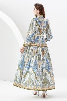 This blue paisley maxi dress from You Spin Me Around is perfect for party or festive occasions. It features a stand collar with puff long sleeves and a flowy silhouette for a timeless look. Its vintage-inspired pattern is sure to make you stand out in any crowd. SIZE GUIDE (CM) Size Bust Waist Sleeve Shoulder Length S 106 110 59 36 135 M 110 114 60 37 136 L 114 118 65 38 137 XL 118 122 66 39 138 XXL 122 126 67 40 139 Vintage French Dress, Barbie Bride, Fall Vintage, French Dress, Paisley Maxi Dress, Puff Long Sleeves, Flowy Maxi Dress, Bride Style, Long Sleeve Maxi