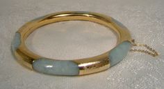 A 14k and jadeite bangle bracelet from the 1930s. This exceptional vintage round yellow gold and genuine natural jadeite bracelet has hand engraved gold encasing or wrapping around the light green mottled jade.  Unlike many examples this one has continuous gold around the interior and six wraps around the jade hoop.  It measures 2-3/8" across the interior wall (inside of bangle measurement) and is 5/16" wide or thick. It has a typical clasp with a heart shaped button.  It is stamped 585 and 14K Antique Round Jade Jewelry, Vintage Jade Round Bracelets, Vintage Round Jade Bracelets, Vintage Jade Bracelets, Round Jade Collectible Jewelry, Collectible Round Jade Jewelry, Vintage Jade Bangle, Antique Accessories, Art Deco Jewelry Vintage