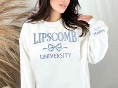 Customize your cozy sweatshirt with your college name, mascot, sport, school name, or more!  Choose a crew neck or hoodie in your favorite color. Initials or word (capital letters) will be embroidered in the cute and preppy arched font, with a cute and trendy coquette bow embroidered below. You may also customize with text of your choice below the bow.  Also includes a name or text of your choice along with a bow embroidered on the sleeve near the cuff. Our high quality embroidery ensures that t School Spirit Crew Neck Sweatshirt For College Events, School Spirit Sweatshirt For College Events, University Logo Sweatshirt For School Spirit, School Spirit Long Sleeve Sweatshirt For College Events, Long Sleeve School Spirit Sweatshirt For College Events, Game Day University Logo Long Sleeve Sweatshirt, Long Sleeve School Spirit Sweatshirt, Game Day University Logo Sweatshirt, University Logo Long Sleeve Sweatshirt For Campus