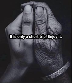 two hands holding each other with the words it is only a short trip enjoy it