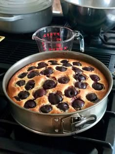 a pan filled with food sitting on top of a stove