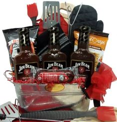 a basket filled with liquor bottles and cooking utensils