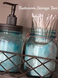 bathroom storage jars with toothbrushes in them