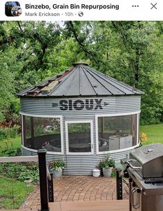 an outdoor grill and gazebo with the word slow written on it's side