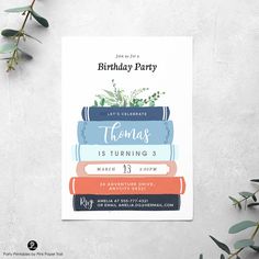 a birthday party card with books and plants