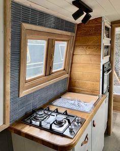 a stove top oven sitting inside of a kitchen