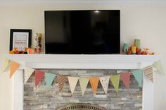 a living room with a fire place and a flat screen tv on top of the fireplace