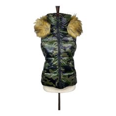 This Is A S13 Women's Green Camo Faux Fur-Trim Hooded Snowcat Down Vest Size Xs * Brand New With Tags! * Polyester, Nylon & Down Materials * Pull-On Style, Zip Closure. Removable Hood. * Armpit To Armpit: 19" * Total Length: 23" * Retail Price: $260! Product Details The Quintessential Puffer Vest, But Make It Fashion. This High-Shine Style By S13 Not Only Looks Good But Is Cold-Weather Approved With Its Down Fill And Faux-Fur Trim. * Approx. Length: 23-1/2" From Center Back To Hem * Stand Collar Fitted Camouflage Winter Outerwear, Fitted Camouflage Outerwear For Winter, Fashion School, Down Feather, Down Vest, Green Camo, School Fashion, Puffer Vest, Fur Trim