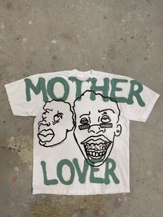 a t - shirt that says mother lover on the front and back with two faces painted on it