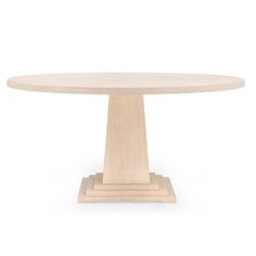 a round wooden table sitting on top of a white floor