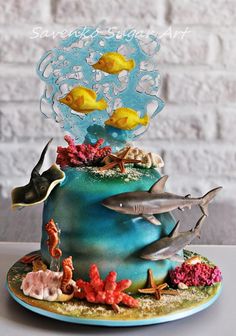 there is a cake decorated with fish and corals