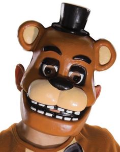 a man wearing a brown bear mask with a black top hat and tie on his head