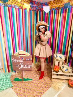 a woman in a costume standing next to a sign