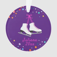 personalized ornament with ice skates and confetti on purple background