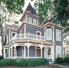 an old victorian style house with two stories on the second floor and three story windows