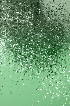 an abstract green and white background with lots of small dots on the bottom of it