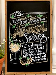 a chalkboard sign with the words time for a cocktail